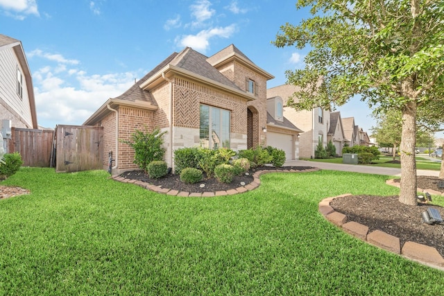 13727 Pedernales Ct, Cypress, TX 77429 - view of front of home with brick siding, an attached garage, concrete driveway, a shingled roof, and a gate