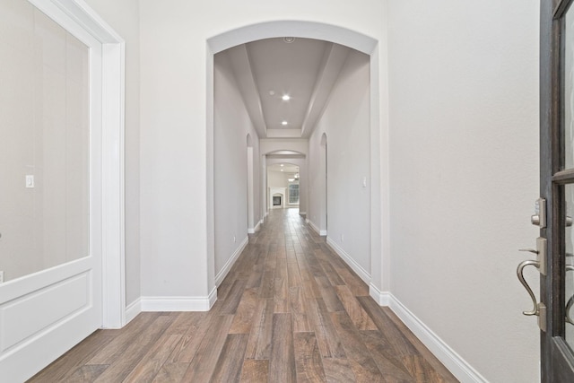 13727 Pedernales Ct, Cypress, TX 77429 - hallway featuring arched walkways, wood finished floors, and recessed lighting
