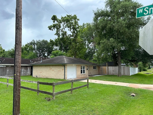 318 N 4th St, Alvin, TX 77511 - view of side of home featuring brick siding