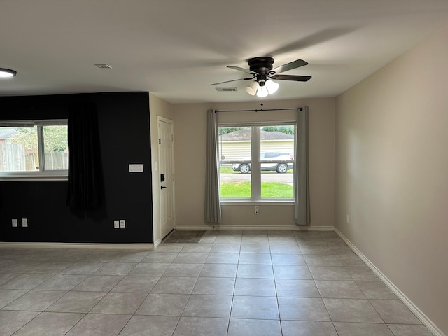 318 N 4th St, Alvin, TX 77511 - spare room with ceiling fan and light tile patterned floors