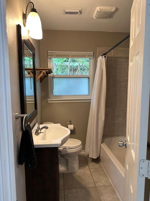 318 N 4th St, Alvin, TX 77511 - bathroom featuring tile patterned flooring, vanity, and shower / bath combo