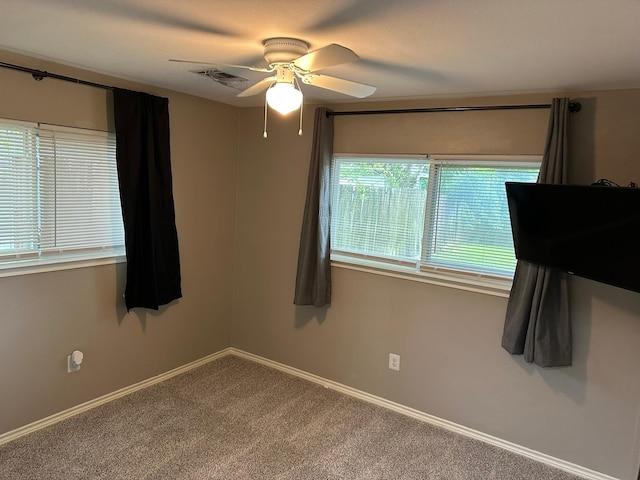 318 N 4th St, Alvin, TX 77511 - spare room featuring ceiling fan and carpet