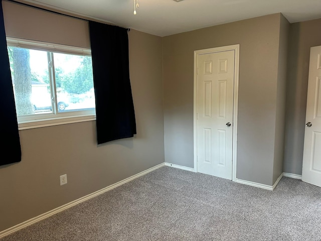 318 N 4th St, Alvin, TX 77511 - spare room featuring carpet floors