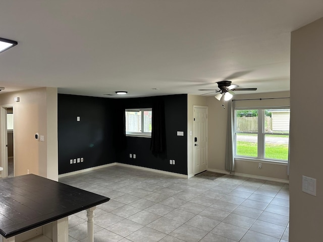 318 N 4th St, Alvin, TX 77511 - unfurnished living room with light tile patterned floors and ceiling fan