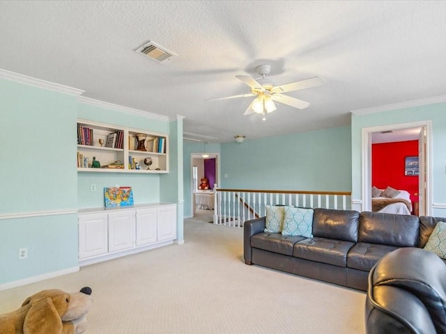4614 Jamaica Dr, Sugar Land, TX 77479 - living area featuring attic access, ceiling fan, light carpet, crown molding, and a textured ceiling