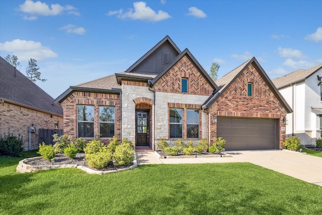 32311 Noble Creek Dr, Conroe, TX 77385 - view of front facade with brick siding, driveway, and roof with shingles