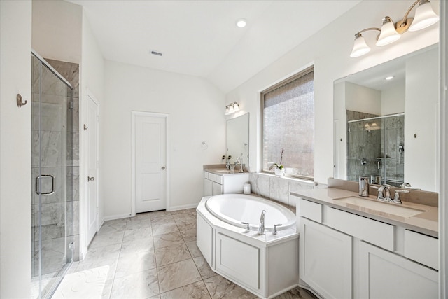 32311 Noble Creek Dr, Conroe, TX 77385 - full bathroom with a stall shower, two vanities, a garden tub, and marble look tiles