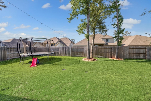 32311 Noble Creek Dr, Conroe, TX 77385 - fenced backyard with a trampoline and a residential view