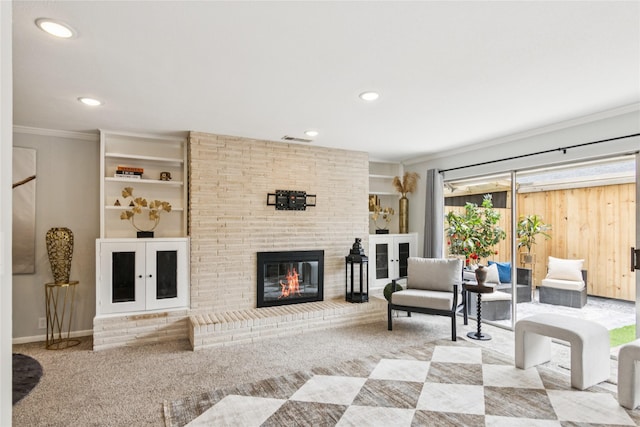 6429 Burgoyne Rd Unit 15, Houston, TX 77057 - living area with crown molding, a brick fireplace, recessed lighting, and carpet