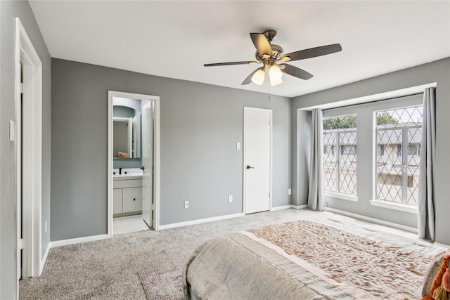 6429 Burgoyne Rd Unit 15, Houston, TX 77057 - carpeted bedroom featuring connected bathroom and a ceiling fan