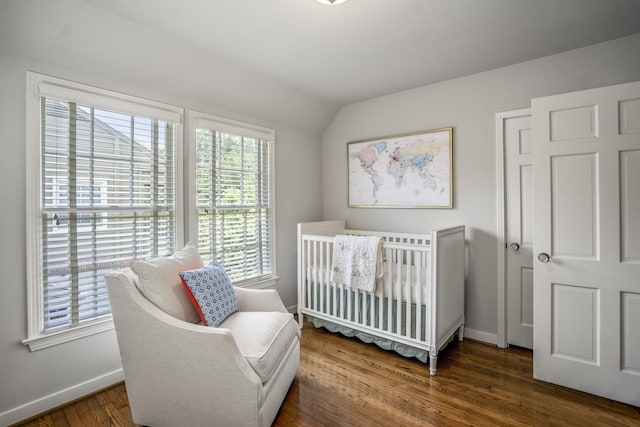 2717 University Blvd, Houston, TX 77005 - bedroom with wood finished floors, a crib, and lofted ceiling