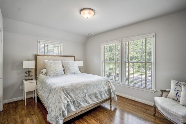 2717 University Blvd, Houston, TX 77005 - bedroom with multiple windows, wood finished floors, and vaulted ceiling