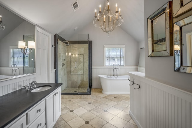 2717 University Blvd, Houston, TX 77005 - bathroom with a chandelier, a wainscoted wall, lofted ceiling, a stall shower, and a soaking tub