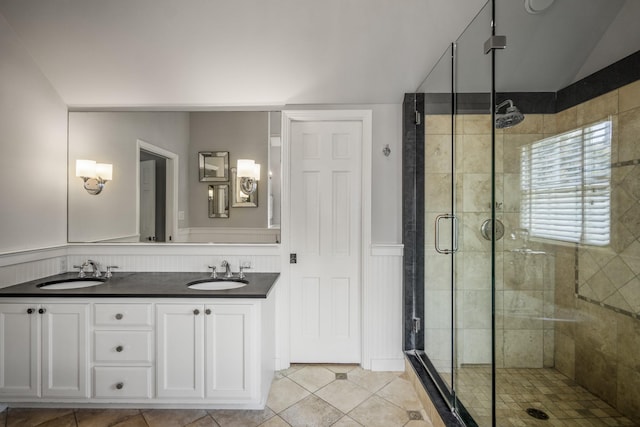 2717 University Blvd, Houston, TX 77005 - full bathroom with a shower stall, a wainscoted wall, double vanity, tile patterned flooring, and lofted ceiling