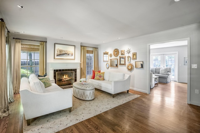 2717 University Blvd, Houston, TX 77005 - living area featuring wood finished floors, a tile fireplace, recessed lighting, and crown molding