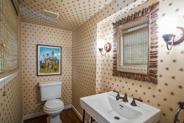 2717 University Blvd, Houston, TX 77005 - bathroom featuring wallpapered walls and wood finished floors