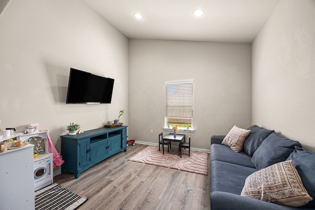 15003 Moonlight Mist Dr, Humble, TX 77346 - living room featuring light wood-type flooring and recessed lighting