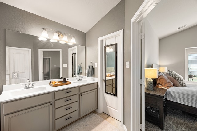 15003 Moonlight Mist Dr, Humble, TX 77346 - ensuite bathroom featuring vaulted ceiling and double vanity