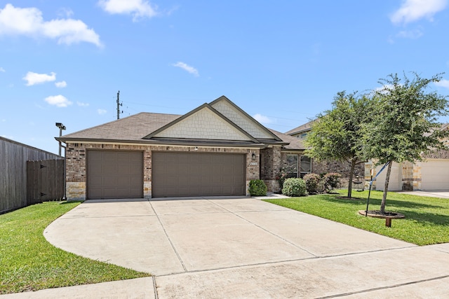 15003 Moonlight Mist Dr, Humble, TX 77346 - view of front facade featuring an attached garage, driveway, brick siding, and a shingled roof