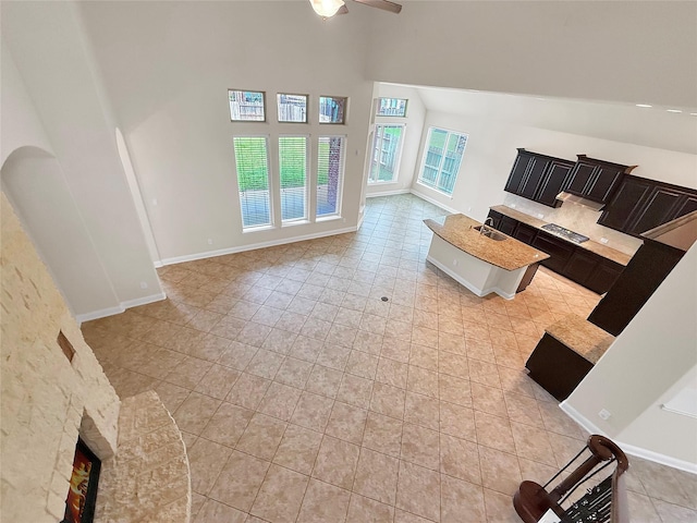 18614 Rimini Ridge Ct, Cypress, TX 77429 - living area with a high ceiling, ceiling fan, and light tile patterned flooring