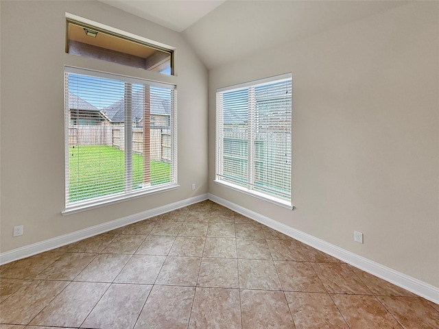 18614 Rimini Ridge Ct, Cypress, TX 77429 - tiled empty room featuring vaulted ceiling and baseboards