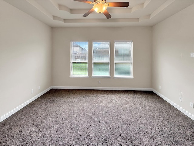 18614 Rimini Ridge Ct, Cypress, TX 77429 - unfurnished room with healthy amount of natural light, a raised ceiling, and dark colored carpet