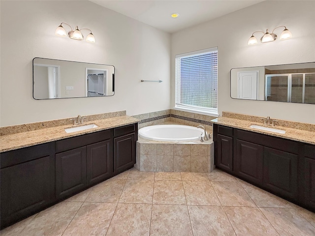 18614 Rimini Ridge Ct, Cypress, TX 77429 - full bath featuring two vanities, a stall shower, a bath, and tile patterned floors