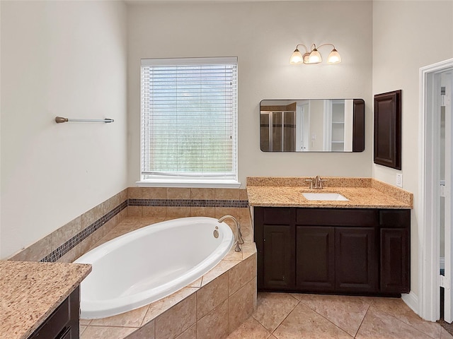 18614 Rimini Ridge Ct, Cypress, TX 77429 - bathroom featuring vanity, a garden tub, and tile patterned flooring
