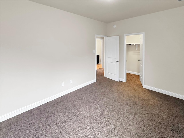 18614 Rimini Ridge Ct, Cypress, TX 77429 - unfurnished bedroom with carpet, a walk in closet, and a closet