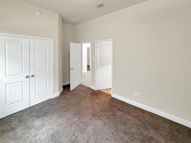 18614 Rimini Ridge Ct, Cypress, TX 77429 - unfurnished bedroom featuring dark colored carpet and a closet