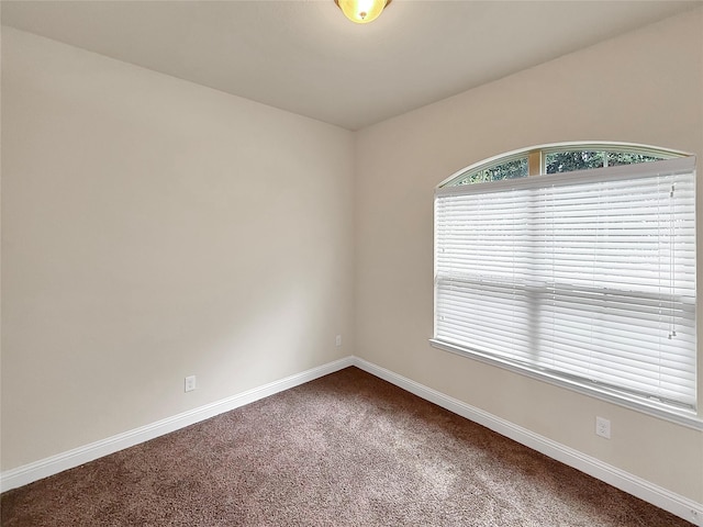 18614 Rimini Ridge Ct, Cypress, TX 77429 - empty room with carpet floors and baseboards