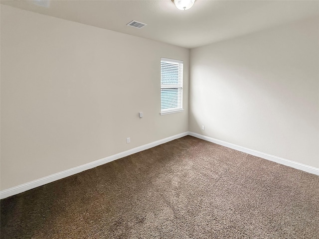 18614 Rimini Ridge Ct, Cypress, TX 77429 - empty room featuring dark colored carpet and baseboards
