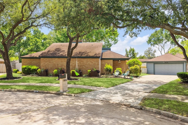 1818 Berryfield Dr, Houston, TX 77077 - mid-century home with a shingled roof, brick siding, and a detached garage