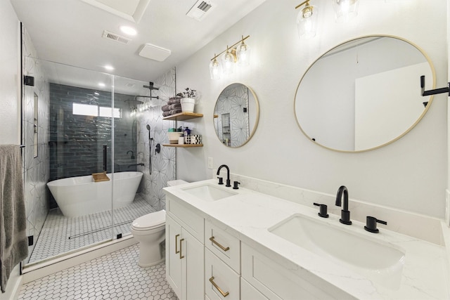 1818 Berryfield Dr, Houston, TX 77077 - bathroom featuring double vanity, a stall shower, a freestanding tub, recessed lighting, and tile patterned floors