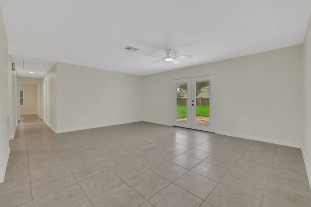 519 N Shady Ln, La Porte, TX 77571 - spare room with ceiling fan, light tile patterned flooring, attic access, and french doors