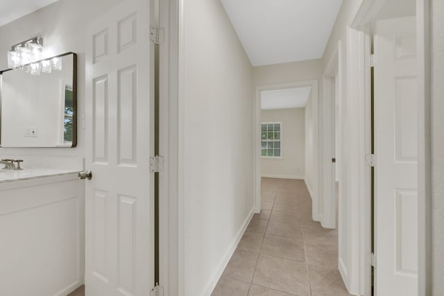 519 N Shady Ln, La Porte, TX 77571 - corridor featuring light tile patterned floors and baseboards