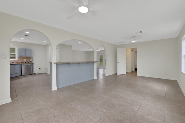 519 N Shady Ln, La Porte, TX 77571 - unfurnished living room featuring a ceiling fan, light tile patterned flooring, recessed lighting, and healthy amount of natural light