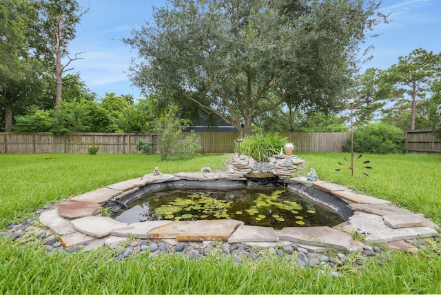 519 N Shady Ln, La Porte, TX 77571 - fenced backyard featuring a garden pond