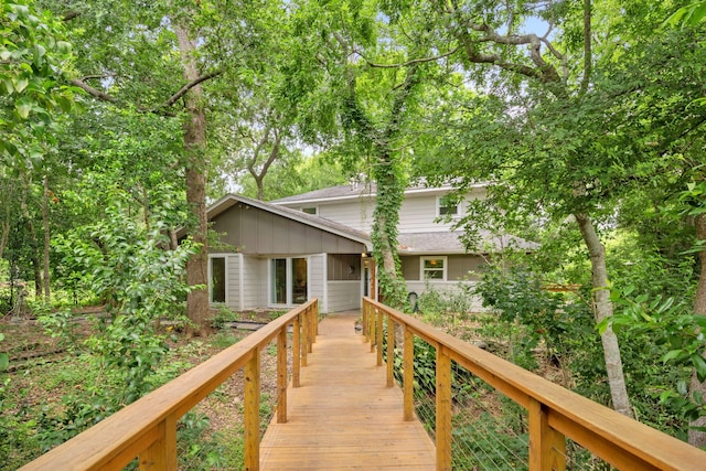 7539 Santa Fe Dr, Houston, TX 77061 - rear view of house with board and batten siding and a shingled roof