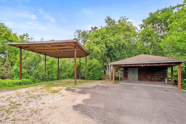 7539 Santa Fe Dr, Houston, TX 77061 - view of vehicle parking with driveway and a detached carport
