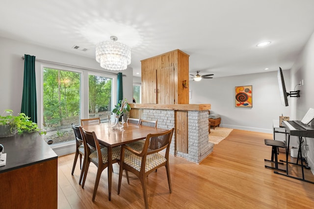 7539 Santa Fe Dr, Houston, TX 77061 - dining room with light wood finished floors, a ceiling fan, recessed lighting, and a chandelier