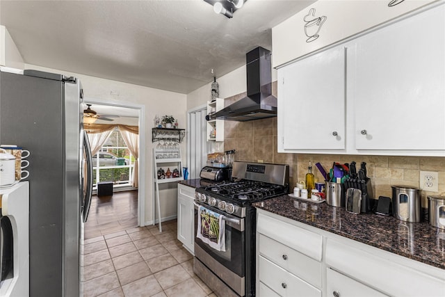 10434 Hinds St, Houston, TX 77034 - kitchen with appliances with stainless steel finishes, white cabinets, wall chimney range hood, and decorative backsplash