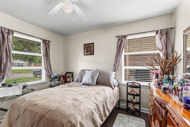 10434 Hinds St, Houston, TX 77034 - bedroom with wood finished floors, a ceiling fan, and baseboard heating