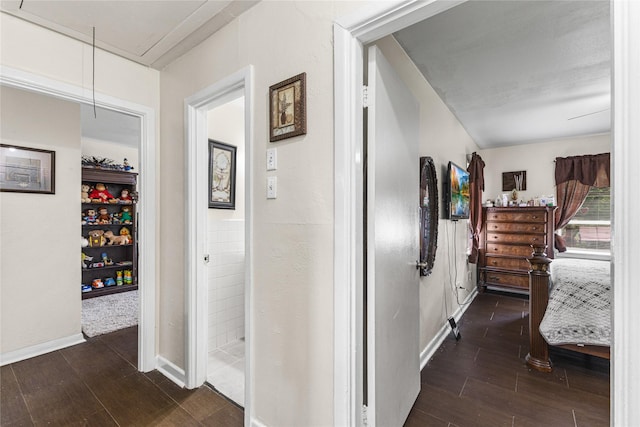 10434 Hinds St, Houston, TX 77034 - corridor featuring attic access and dark wood-style floors