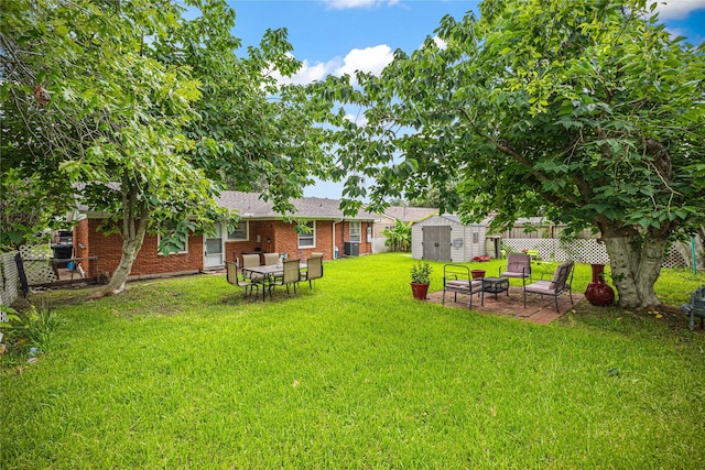 10434 Hinds St, Houston, TX 77034 - fenced backyard with a shed, an outdoor fire pit, and a patio