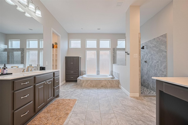 4107 Rainflower Ct, Fulshear, TX 77441 - full bathroom featuring vanity, a bath, walk in shower, and marble look tile flooring