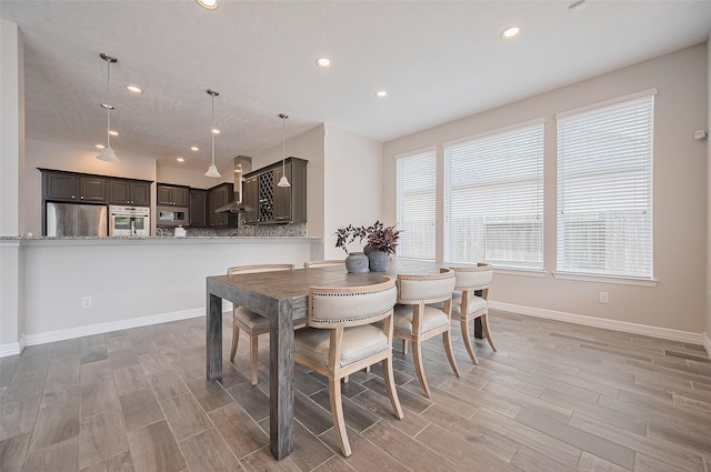 4107 Rainflower Ct, Fulshear, TX 77441 - dining room with light wood-style floors and recessed lighting