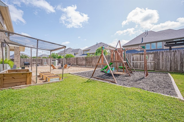 4107 Rainflower Ct, Fulshear, TX 77441 - fenced backyard featuring a playground and a garden