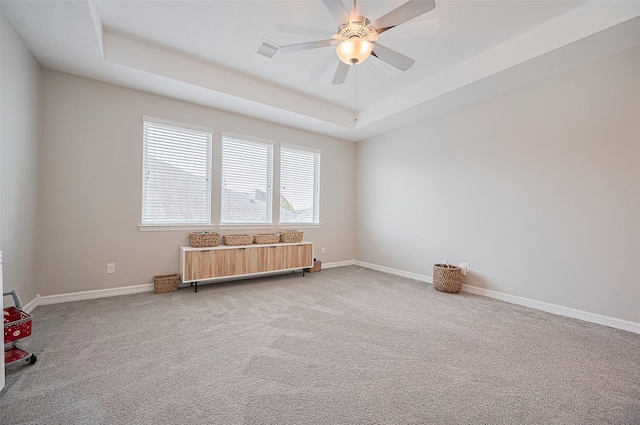4107 Rainflower Ct, Fulshear, TX 77441 - unfurnished room with a tray ceiling, light colored carpet, and a ceiling fan