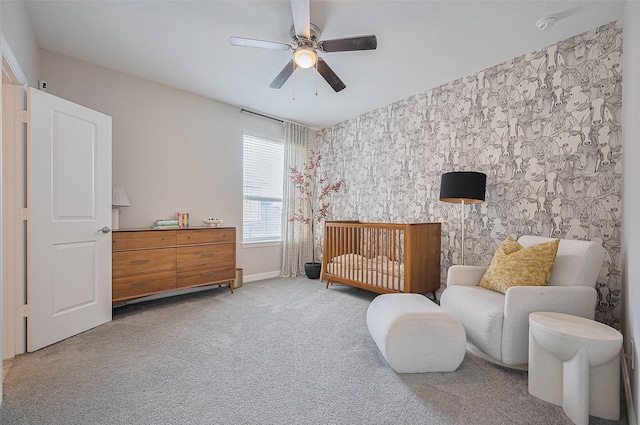 4107 Rainflower Ct, Fulshear, TX 77441 - bedroom featuring wallpapered walls, carpet, a nursery area, and a ceiling fan